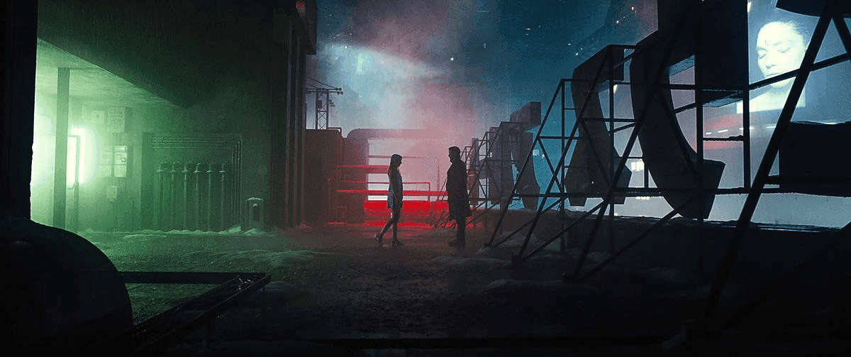 Film frame from Blade Runner 2049 showing neon-lit interior scene